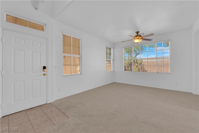 5653 Mount Athos St, North Las Vegas, NV 89031 - spare room with light colored carpet and a ceiling fan