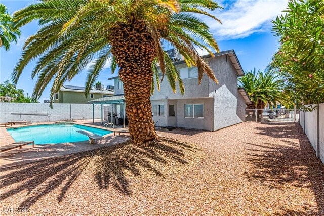 3158 Brockington Dr, Las Vegas, NV 89120 - view of pool with a diving board, a fenced backyard, and a patio