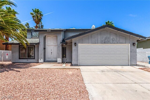 3158 Brockington Dr, Las Vegas, NV 89120 - view of front of home with a garage, driveway, and stucco siding