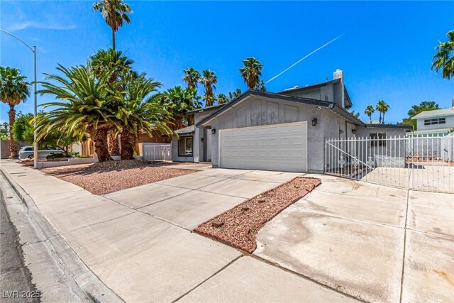 3158 Brockington Dr, Las Vegas, NV 89120 - ranch-style house featuring an attached garage, driveway, and a chimney