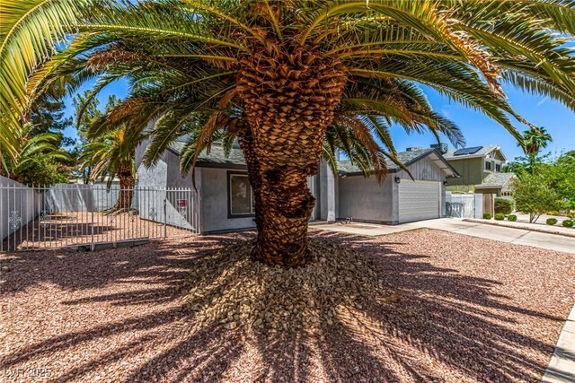 3158 Brockington Dr, Las Vegas, NV 89120 - obstructed view of property featuring concrete driveway and an attached garage
