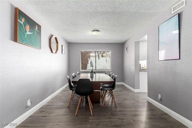 3158 Brockington Dr, Las Vegas, NV 89120 - dining area featuring dark wood finished floors and a textured ceiling