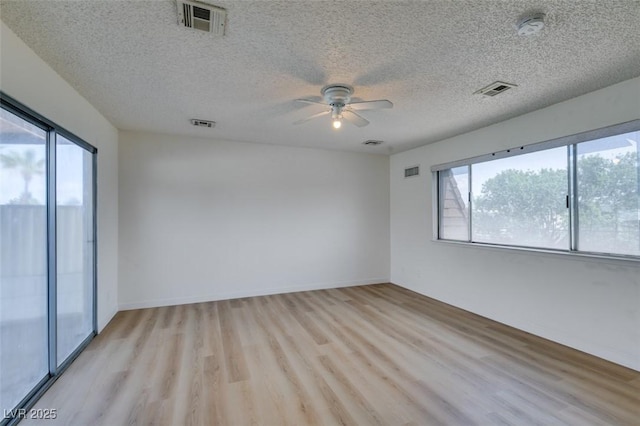 3785 Decade St, Las Vegas, NV 89121 - spare room with a smoke detector, light wood-style floors, a ceiling fan, and a textured ceiling