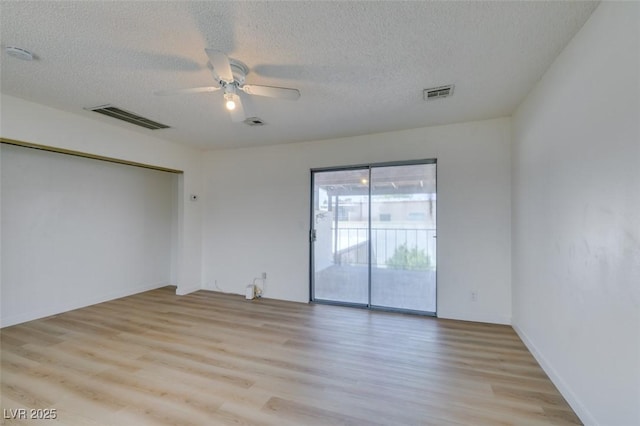 3785 Decade St, Las Vegas, NV 89121 - unfurnished room with light wood-style floors, ceiling fan, a textured ceiling, and a smoke detector
