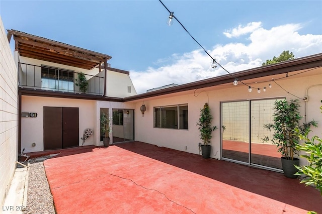 3785 Decade St, Las Vegas, NV 89121 - rear view of house featuring stucco siding and a patio