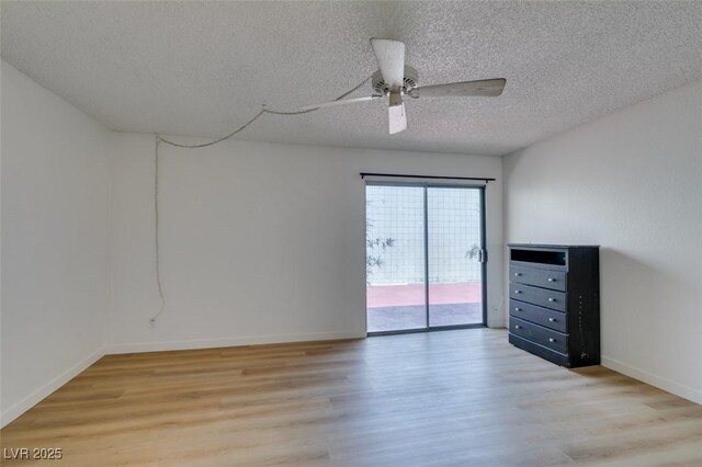 3785 Decade St, Las Vegas, NV 89121 - empty room featuring light wood-style flooring, a textured ceiling, and a ceiling fan
