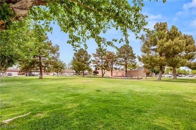 3785 Decade St, Las Vegas, NV 89121 - surrounding community with a lawn