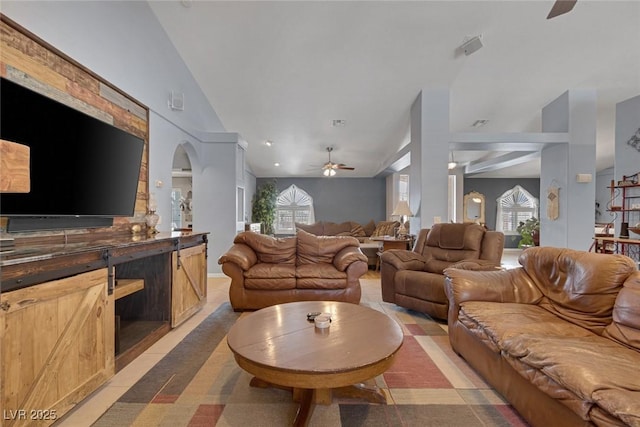9015 S Tenaya Way, Las Vegas, NV 89113 - living room with vaulted ceiling, a ceiling fan, and arched walkways