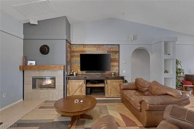 9015 S Tenaya Way, Las Vegas, NV 89113 - living area with a fireplace, vaulted ceiling, and arched walkways