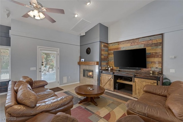 9015 S Tenaya Way, Las Vegas, NV 89113 - living room featuring vaulted ceiling, a fireplace, and ceiling fan