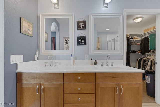 9015 S Tenaya Way, Las Vegas, NV 89113 - bathroom featuring double vanity and a walk in closet