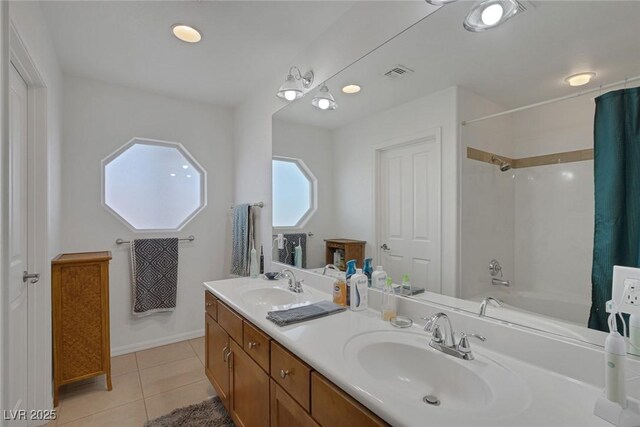 9015 S Tenaya Way, Las Vegas, NV 89113 - bathroom featuring double vanity, tile patterned floors, and shower / bathtub combination with curtain
