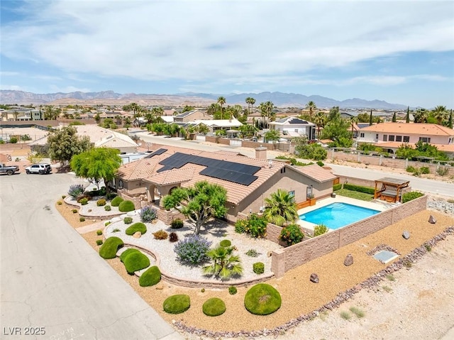 9015 S Tenaya Way, Las Vegas, NV 89113 - aerial view of residential area with a mountainous background and a pool area