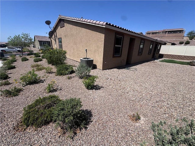 2653 Crystal Blue St, Laughlin, NV 89029 - view of side of home featuring stucco siding and a tiled roof