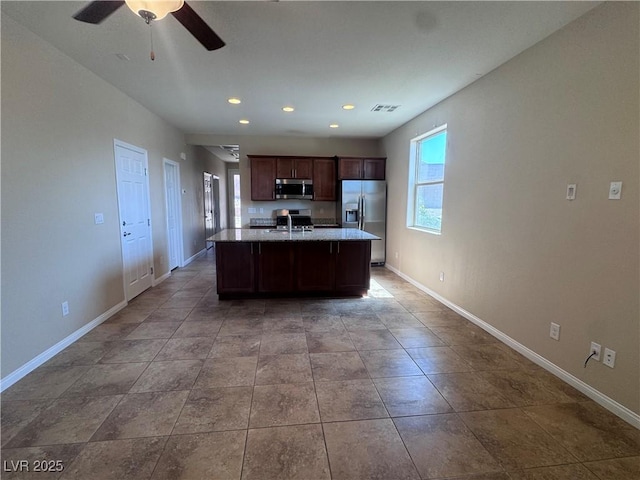 2653 Crystal Blue St, Laughlin, NV 89029 - kitchen featuring stainless steel appliances, ceiling fan, a kitchen island with sink, recessed lighting, and dark brown cabinetry