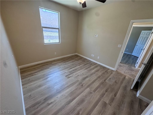 2653 Crystal Blue St, Laughlin, NV 89029 - empty room with a ceiling fan and wood finished floors