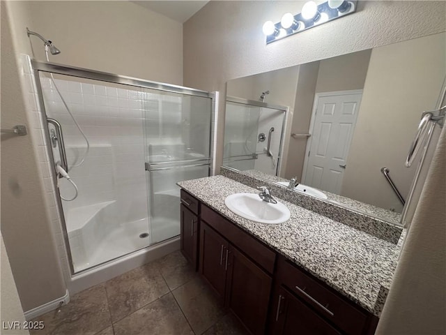 2653 Crystal Blue St, Laughlin, NV 89029 - bathroom with a shower stall, vanity, and tile patterned flooring