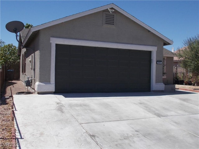 2211 Chipplegate Way N, Las Vegas, NV 89032 - view of front of home with stucco siding, a garage, and concrete driveway