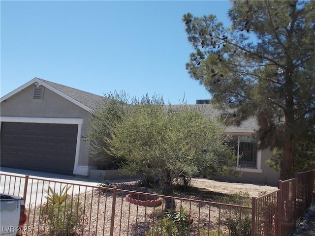 2211 Chipplegate Way N, Las Vegas, NV 89032 - view of front of home with stucco siding and an attached garage