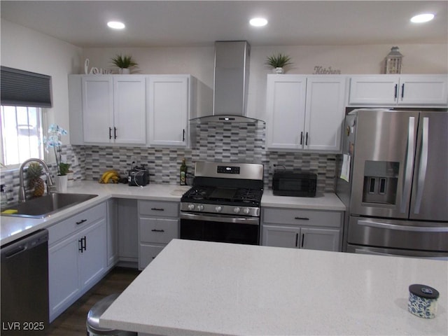 2211 Chipplegate Way N, Las Vegas, NV 89032 - kitchen featuring appliances with stainless steel finishes, wall chimney range hood, decorative backsplash, recessed lighting, and white cabinetry