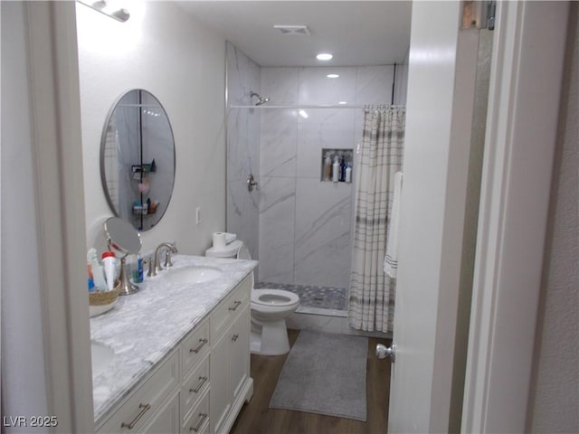 2211 Chipplegate Way N, Las Vegas, NV 89032 - full bath featuring double vanity, tiled shower, wood finished floors, and recessed lighting