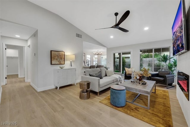 7701 Sea Cliff Way, Las Vegas, NV 89128 - living area featuring ceiling fan, a chandelier, light wood-type flooring, high vaulted ceiling, and recessed lighting