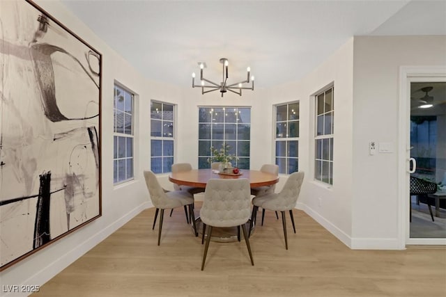 7701 Sea Cliff Way, Las Vegas, NV 89128 - dining area featuring a chandelier and light wood-style floors