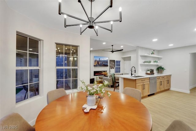 7701 Sea Cliff Way, Las Vegas, NV 89128 - dining room featuring recessed lighting, light wood finished floors, a chandelier, and a ceiling fan