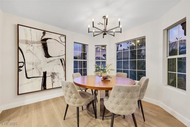 7701 Sea Cliff Way, Las Vegas, NV 89128 - dining space with a chandelier and light wood-type flooring