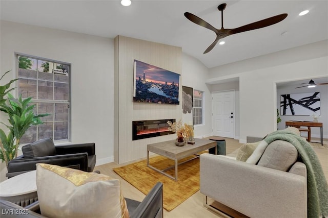 7701 Sea Cliff Way, Las Vegas, NV 89128 - living room with a ceiling fan, a fireplace, lofted ceiling, recessed lighting, and light wood-style flooring