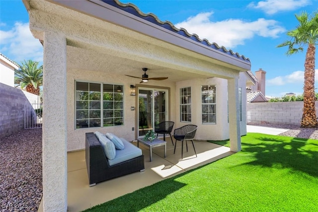 7701 Sea Cliff Way, Las Vegas, NV 89128 - fenced backyard with a ceiling fan and a patio area