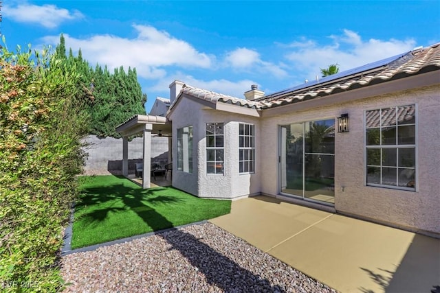 7701 Sea Cliff Way, Las Vegas, NV 89128 - rear view of property with a tiled roof, stucco siding, a patio area, and a yard