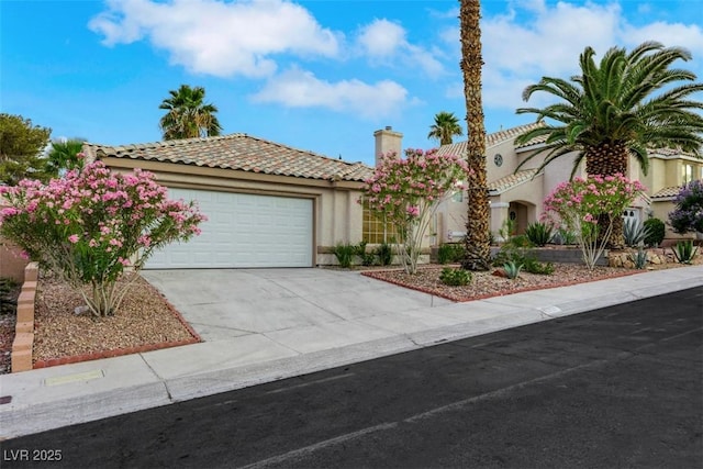 7701 Sea Cliff Way, Las Vegas, NV 89128 - mediterranean / spanish house with a tile roof, an attached garage, stucco siding, driveway, and a chimney