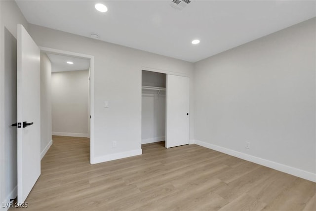 7701 Sea Cliff Way, Las Vegas, NV 89128 - unfurnished bedroom with recessed lighting, light wood-style flooring, and a closet