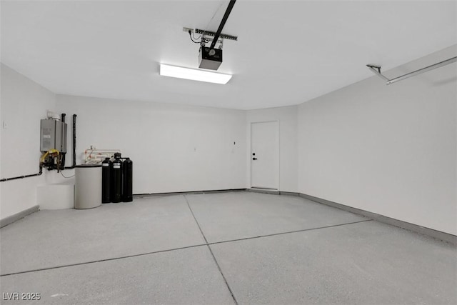 7701 Sea Cliff Way, Las Vegas, NV 89128 - garage featuring water heater and a garage door opener