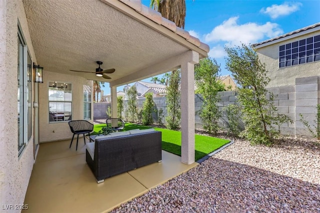 7701 Sea Cliff Way, Las Vegas, NV 89128 - fenced backyard with ceiling fan, a patio area, and outdoor lounge area