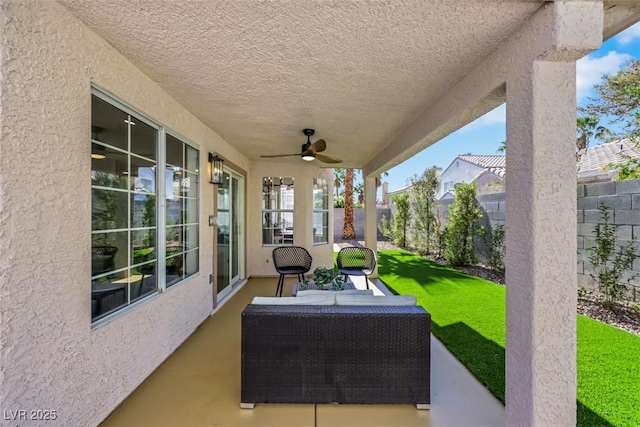7701 Sea Cliff Way, Las Vegas, NV 89128 - fenced backyard featuring ceiling fan, a patio, and an outdoor living space