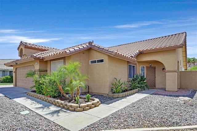 100 Crossfoot Terrace Ct, Henderson, NV 89002 - view of property exterior featuring an attached garage, stucco siding, and a tiled roof