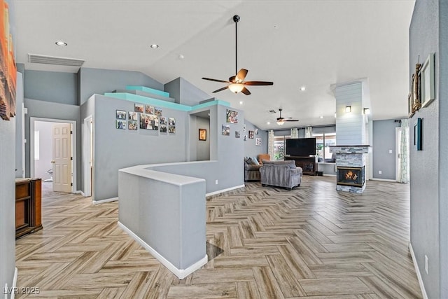 100 Crossfoot Terrace Ct, Henderson, NV 89002 - living area with ceiling fan, a stone fireplace, high vaulted ceiling, and recessed lighting
