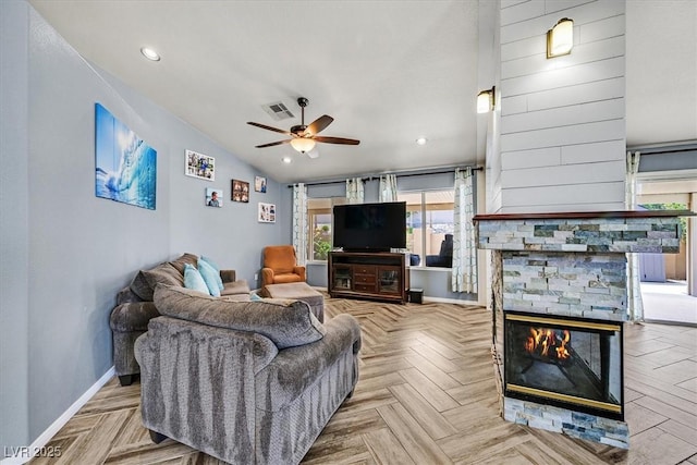 100 Crossfoot Terrace Ct, Henderson, NV 89002 - living area featuring ceiling fan, lofted ceiling, and a stone fireplace