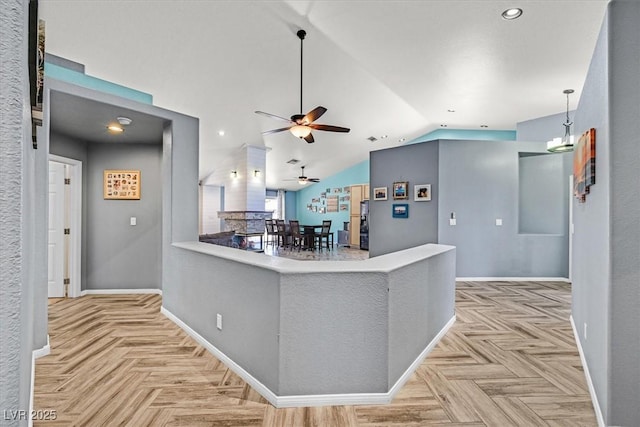 100 Crossfoot Terrace Ct, Henderson, NV 89002 - kitchen featuring a ceiling fan, vaulted ceiling, recessed lighting, decorative light fixtures, and a peninsula