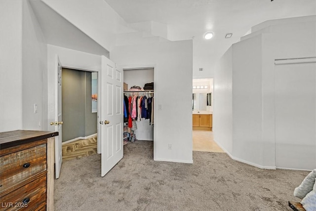100 Crossfoot Terrace Ct, Henderson, NV 89002 - unfurnished bedroom with carpet floors, a walk in closet, and ensuite bath