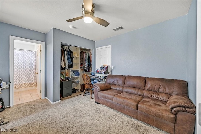 100 Crossfoot Terrace Ct, Henderson, NV 89002 - carpeted living room with a ceiling fan and tile patterned floors