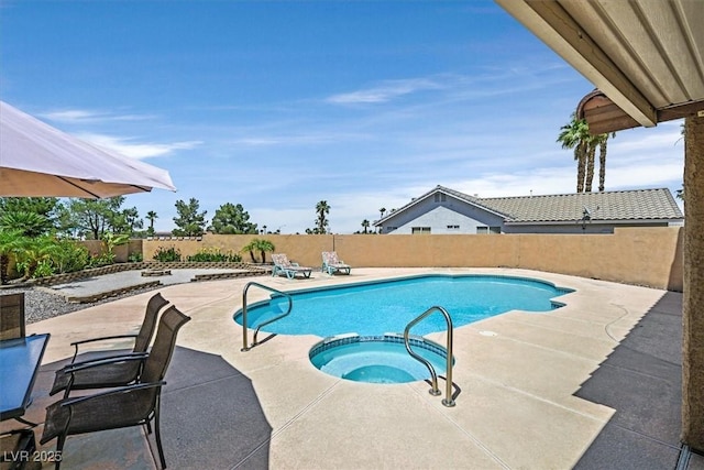 100 Crossfoot Terrace Ct, Henderson, NV 89002 - view of pool with a fenced backyard, a patio, and a pool with connected hot tub