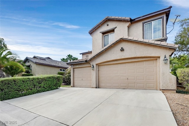 9044 Blue Raven Ave Unit R, Las Vegas, NV 89143 - view of front facade with stucco siding, a garage, driveway, and a tiled roof