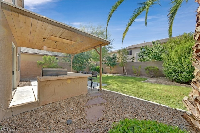 9044 Blue Raven Ave Unit R, Las Vegas, NV 89143 - fenced backyard with a patio area