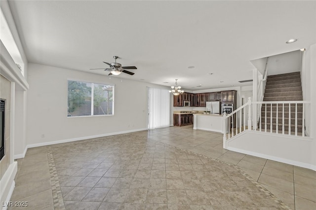 9044 Blue Raven Ave Unit R, Las Vegas, NV 89143 - unfurnished living room with stairway, a chandelier, light tile patterned flooring, ceiling fan, and recessed lighting