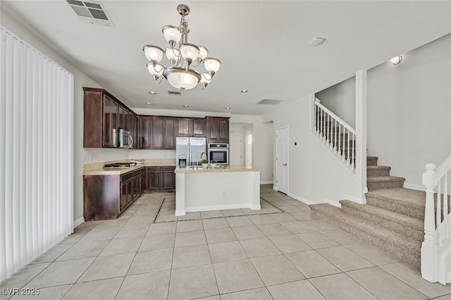 9044 Blue Raven Ave Unit R, Las Vegas, NV 89143 - kitchen featuring appliances with stainless steel finishes, light countertops, dark brown cabinetry, a chandelier, and recessed lighting