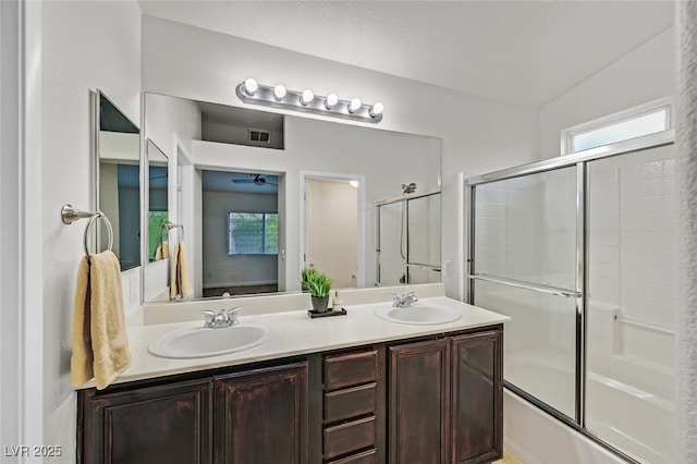 9044 Blue Raven Ave Unit R, Las Vegas, NV 89143 - full bathroom featuring double vanity, enclosed tub / shower combo, and ceiling fan