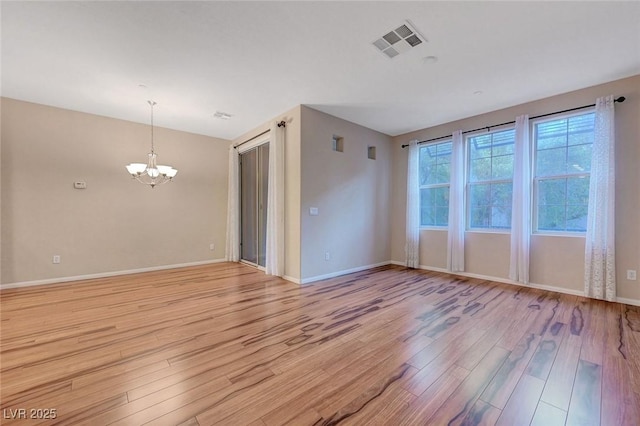 7856 Carysford Ave, Las Vegas, NV 89178 - spare room with light wood-type flooring and a chandelier